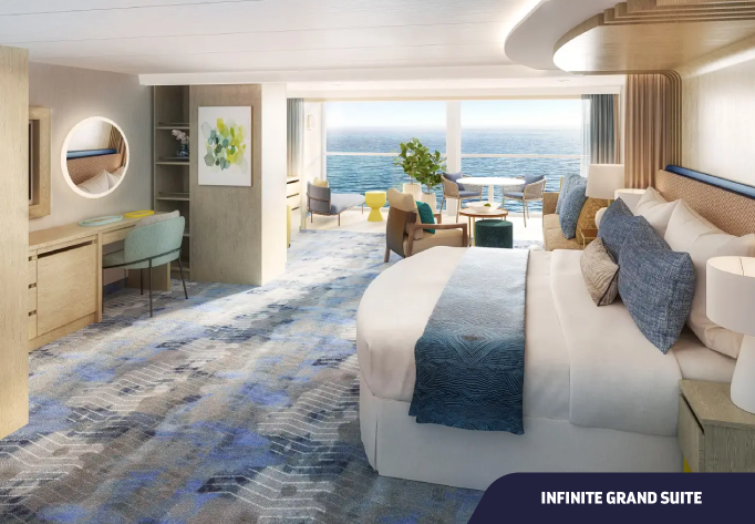 Foto da Cabine Infinite Grand Suite com cama, sofá, escrivaninha e varanda com vista para o mar