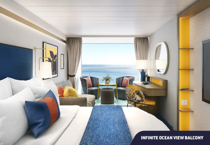 Foto da Cabine Infinite Ocean View Balcony com cama, sofá, escrivaninha e janela com vista para o mar