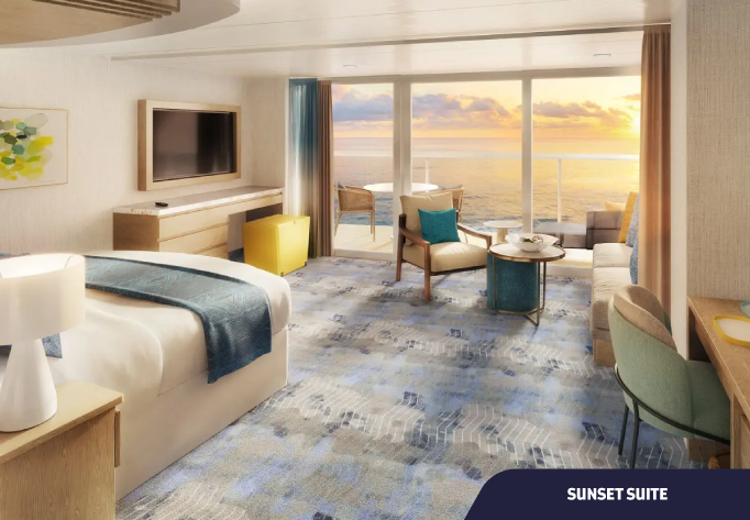 Foto de Cabine Sunset Suite com cama, poltrona, escrivaninha e varanda com vista para o mar